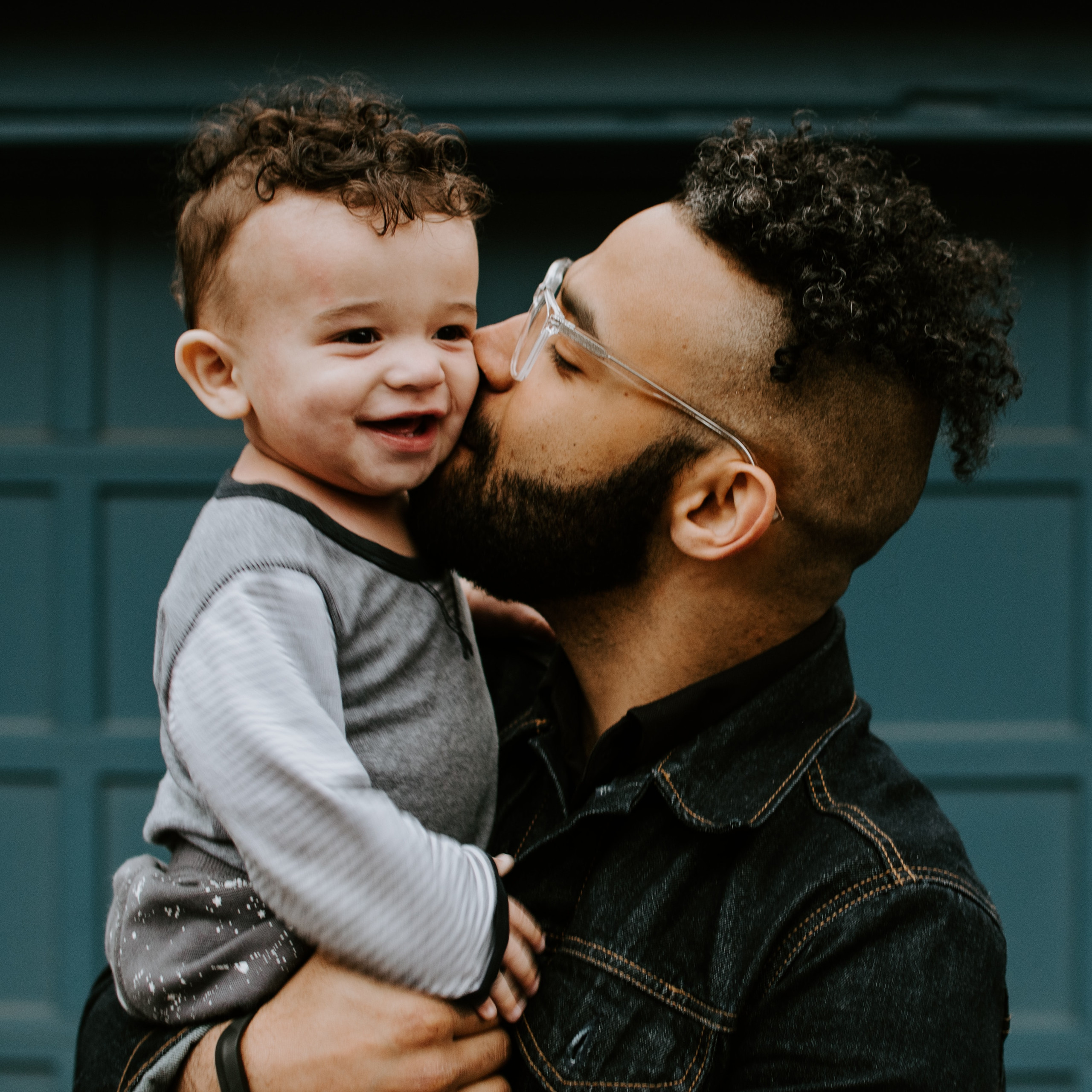 Man carrying baby boy